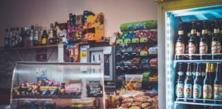 How to boost your store’s profitability: Strategies for cutting costs and increasing sales silver-display-shelf-on-brown-sectional-table